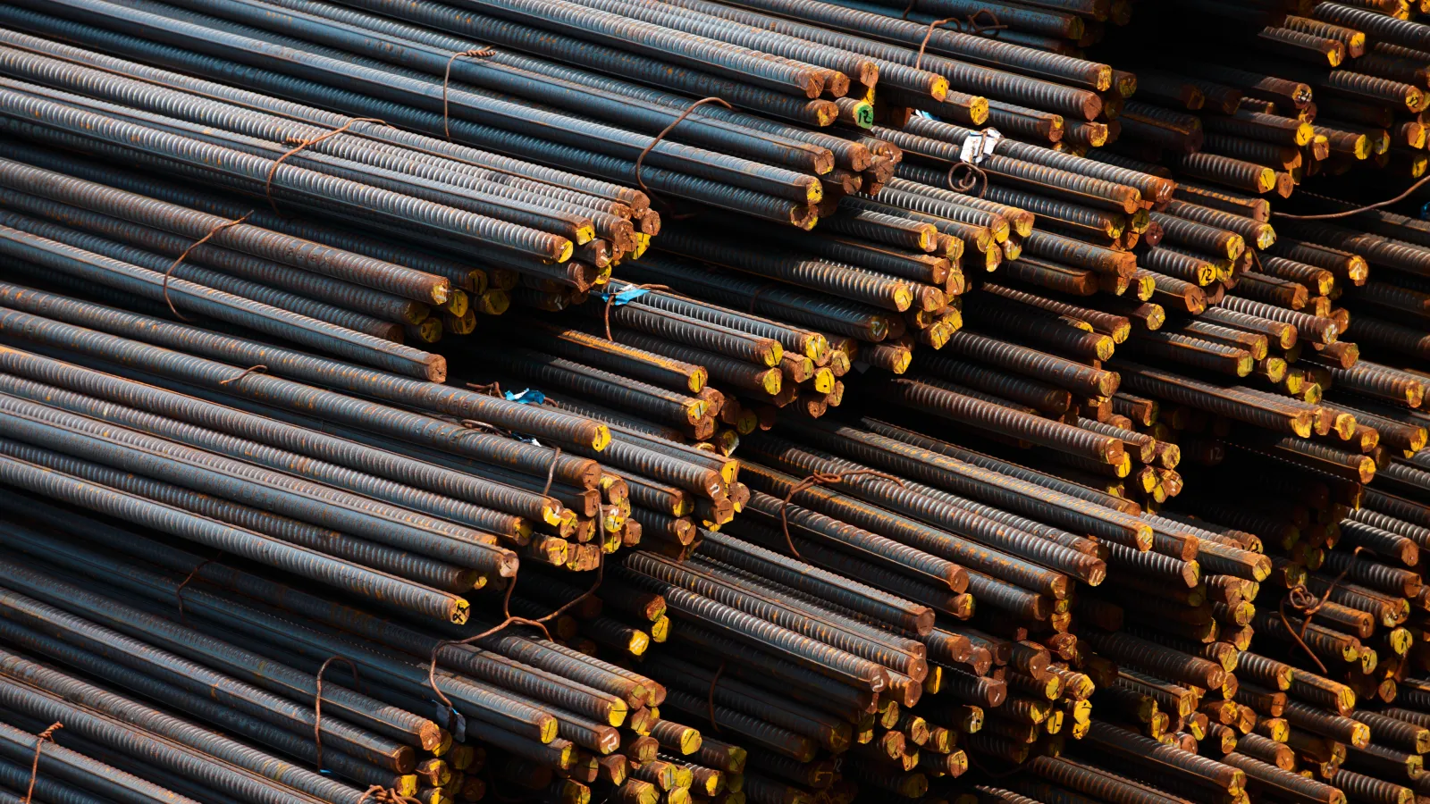 a group of bees on a metal surface