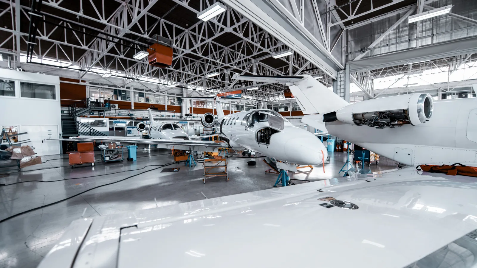 a large white airplane in a hangar