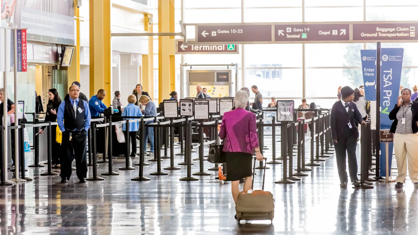 people waiting in line at an airport