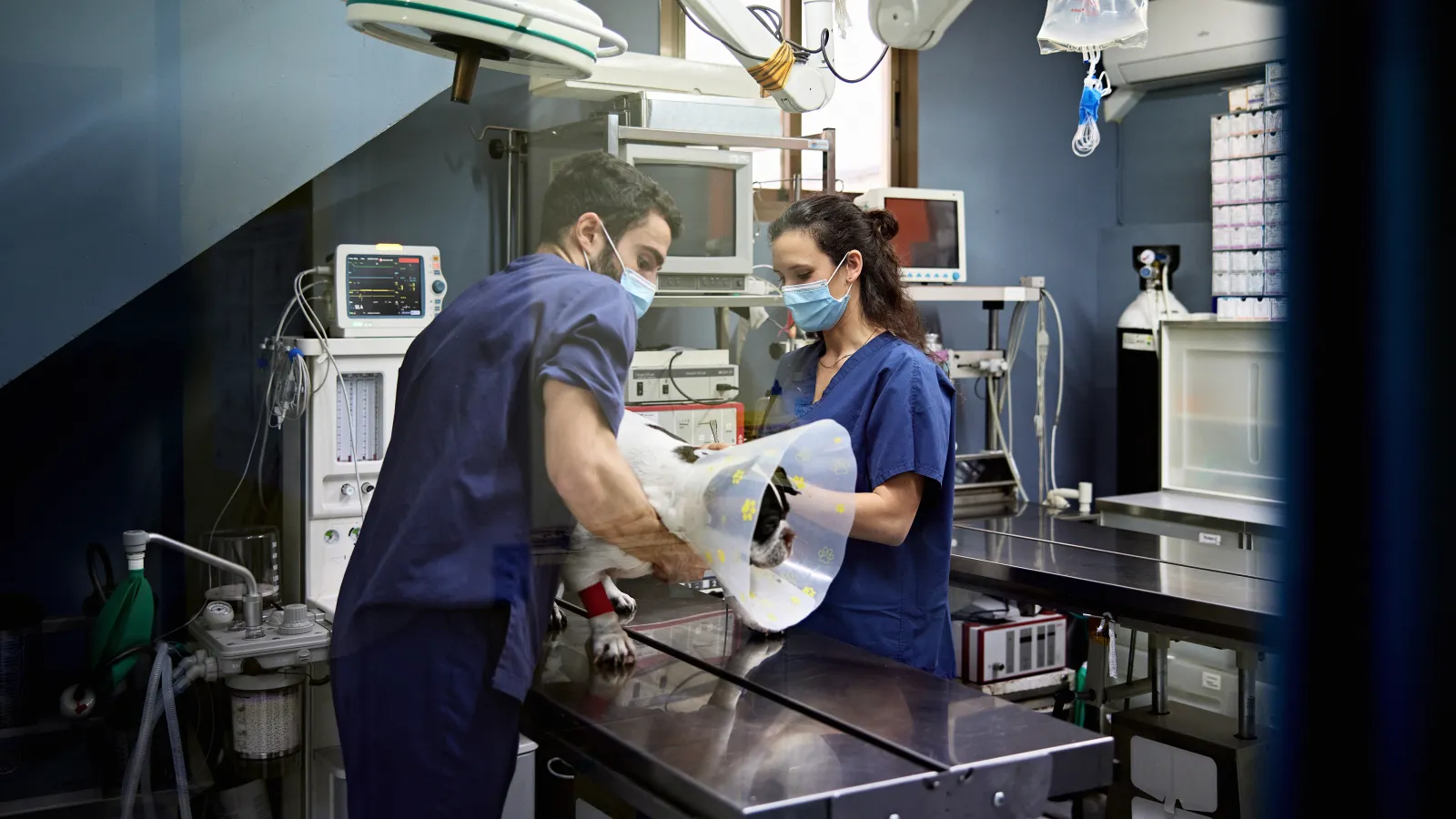 a couple of people in a room with equipment
