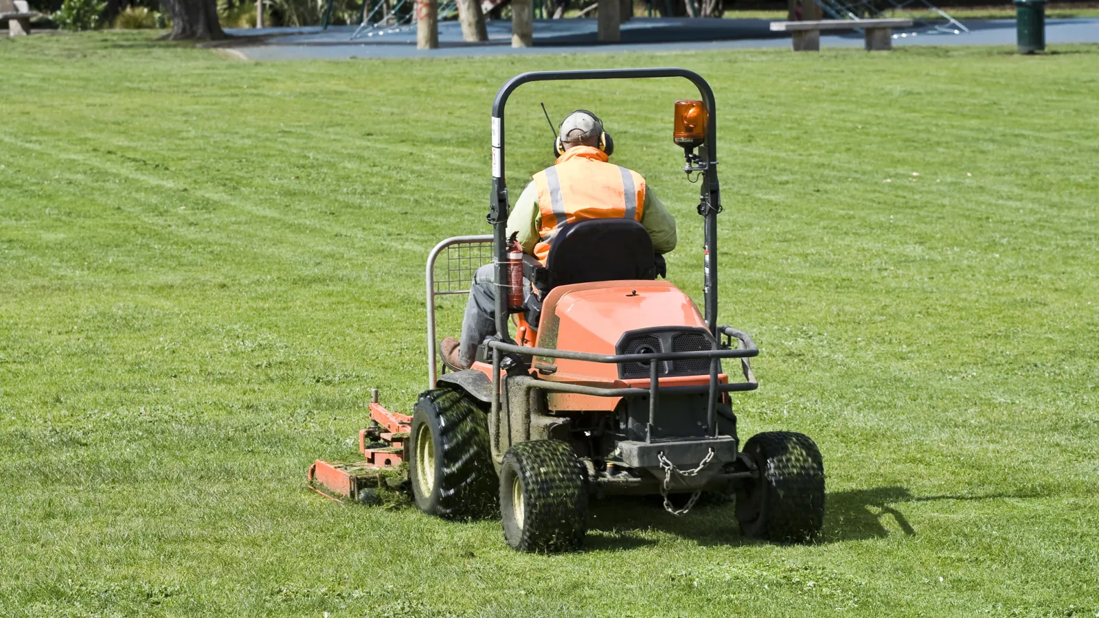 a person driving a lawn mower