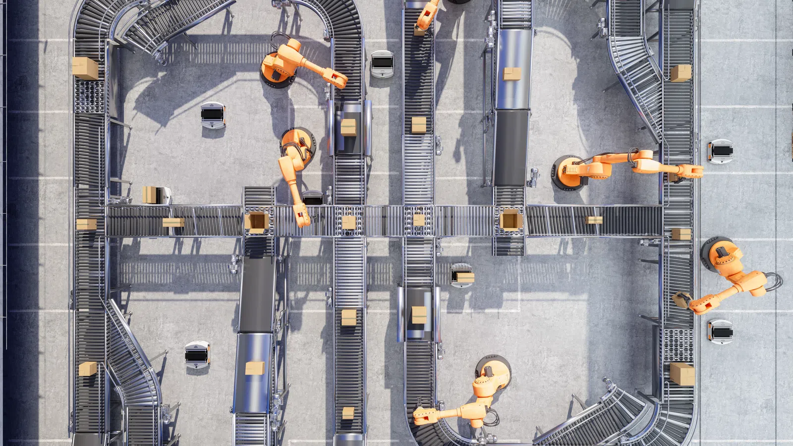 Top-down view of an automated warehouse conveyor system with robotic arms handling packages on metal tracks.