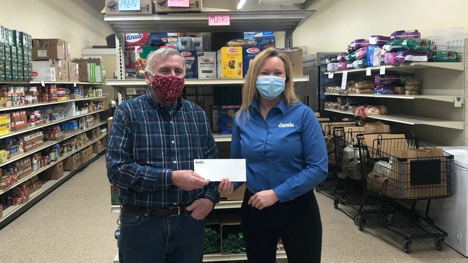 Lapels® Dry Cleaning makes donation to Marshfield Food Pantry