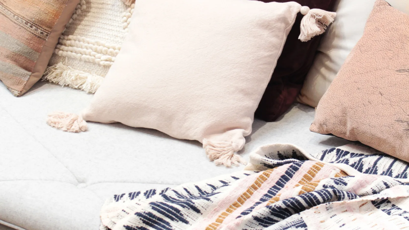 a bed with pillows
