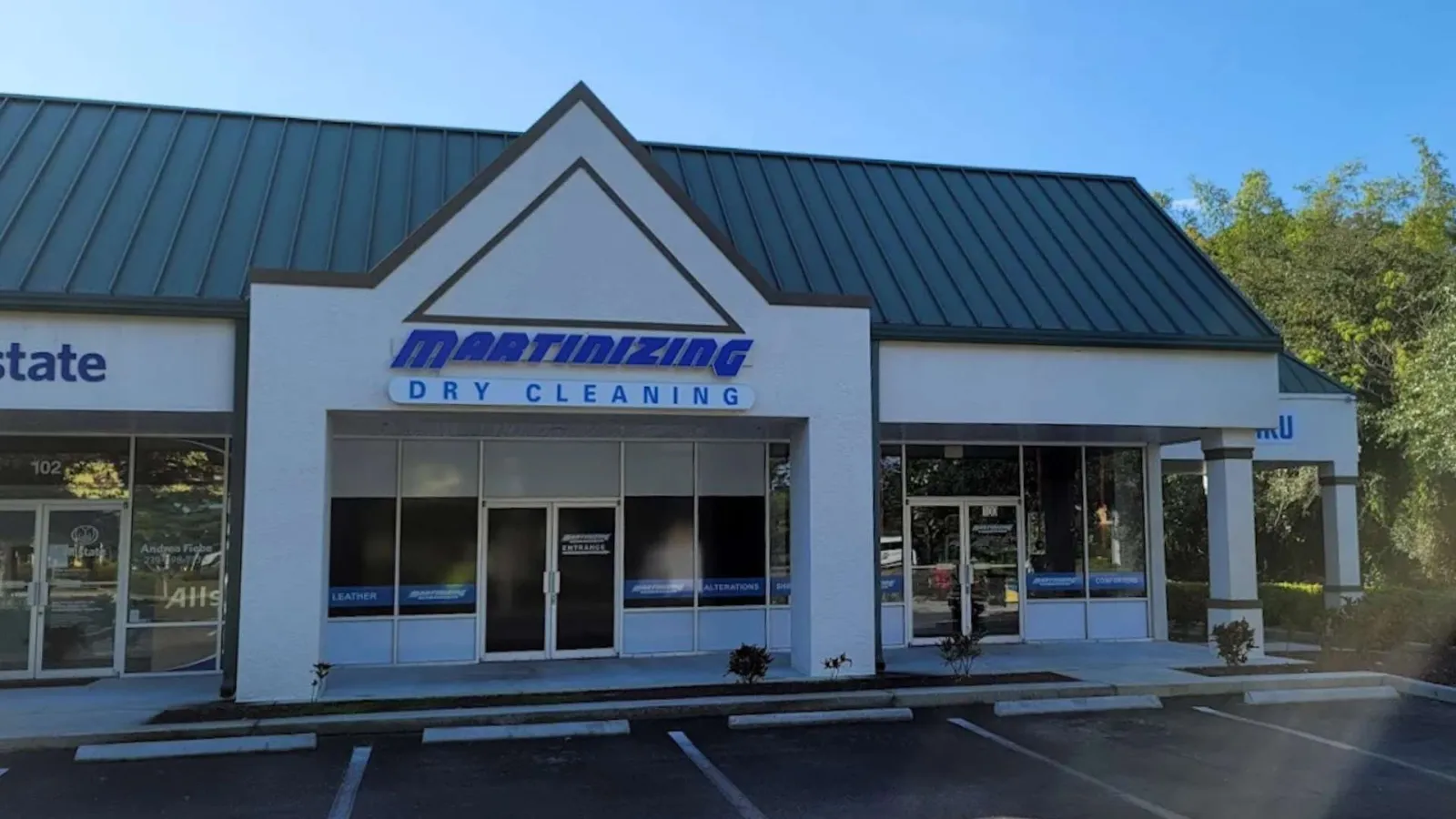 Front view of Martinizing Dry Cleaning storefront in Bonita Springs. FL with drive thru service.