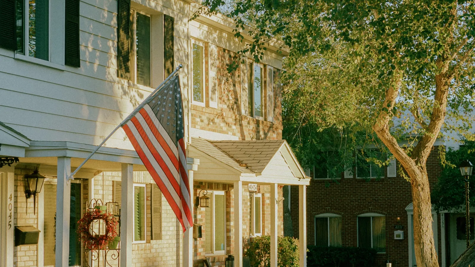 a flag on a pole in front of a building