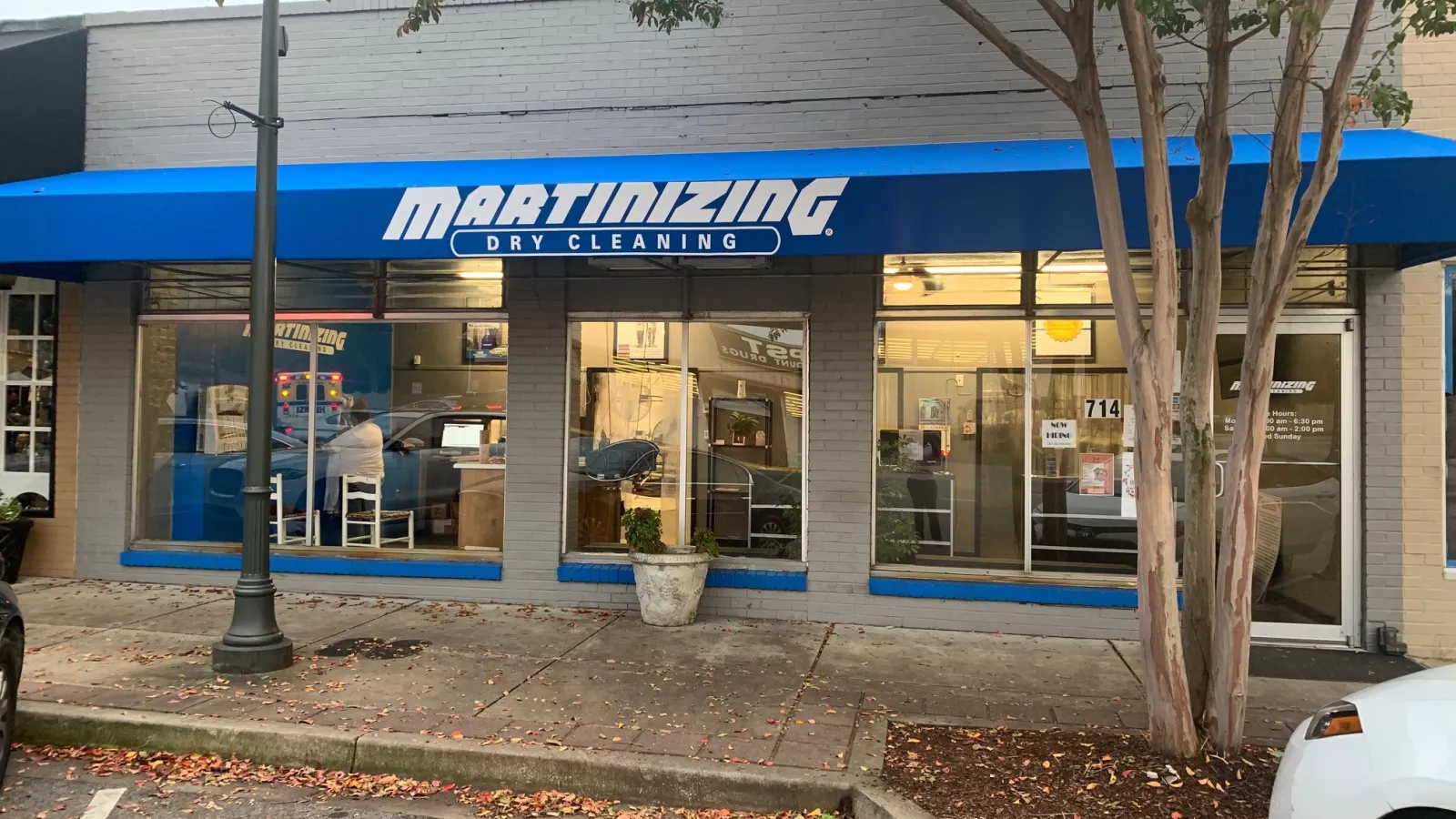 a store front with a blue awning