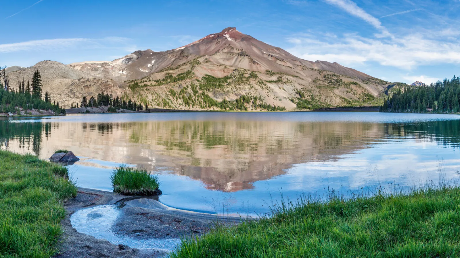 a lake with a mountain in the background