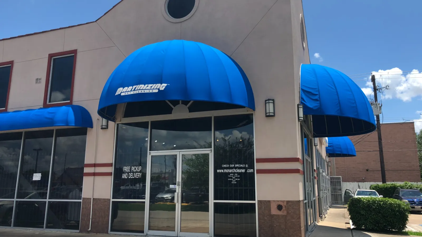a building with blue awnings