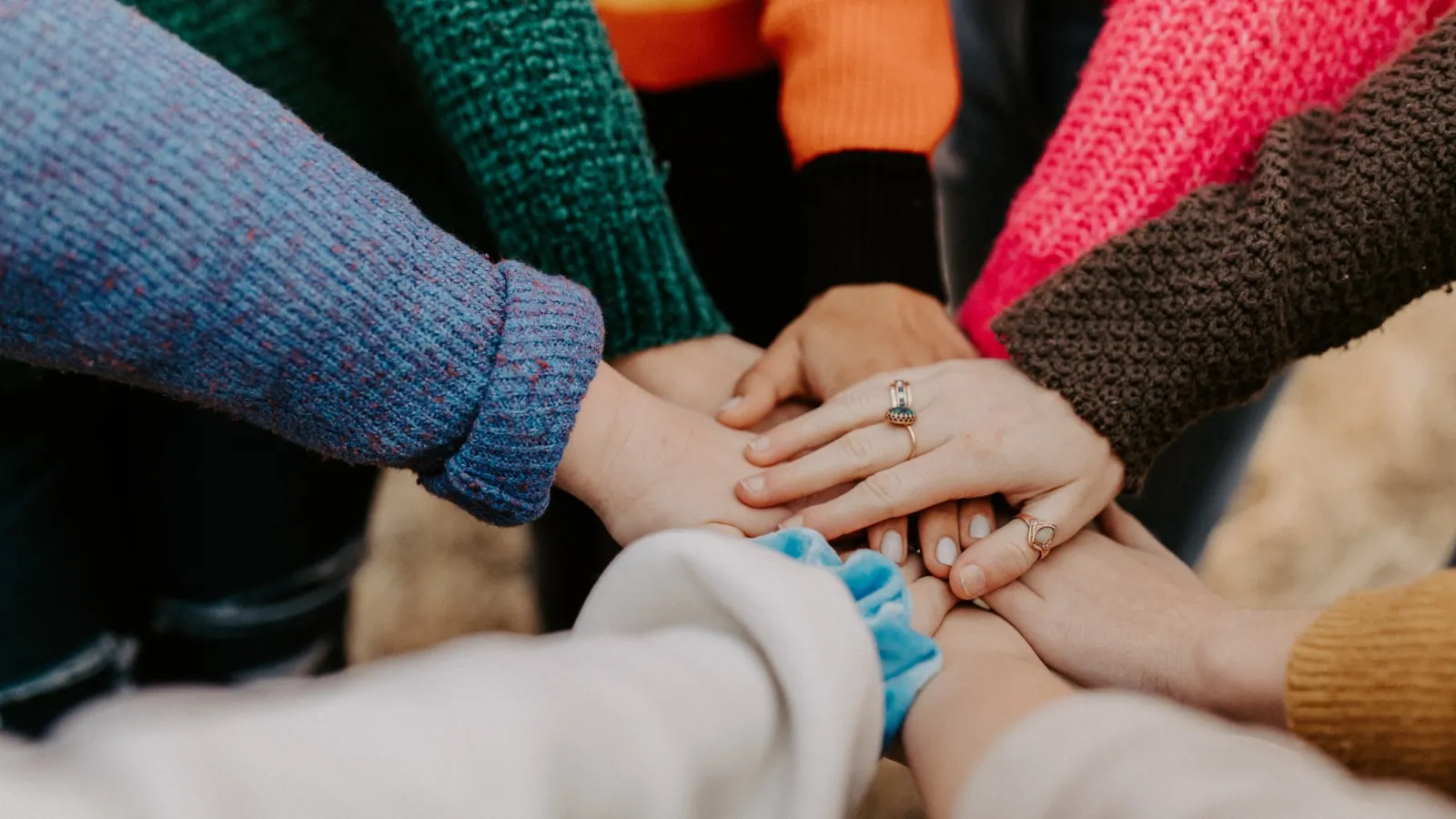 a group of people holding hands