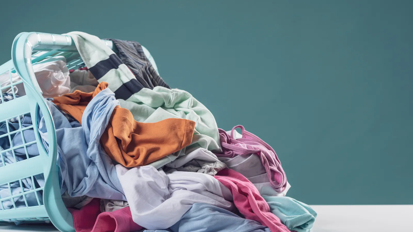 clothes falling out of a hamper
