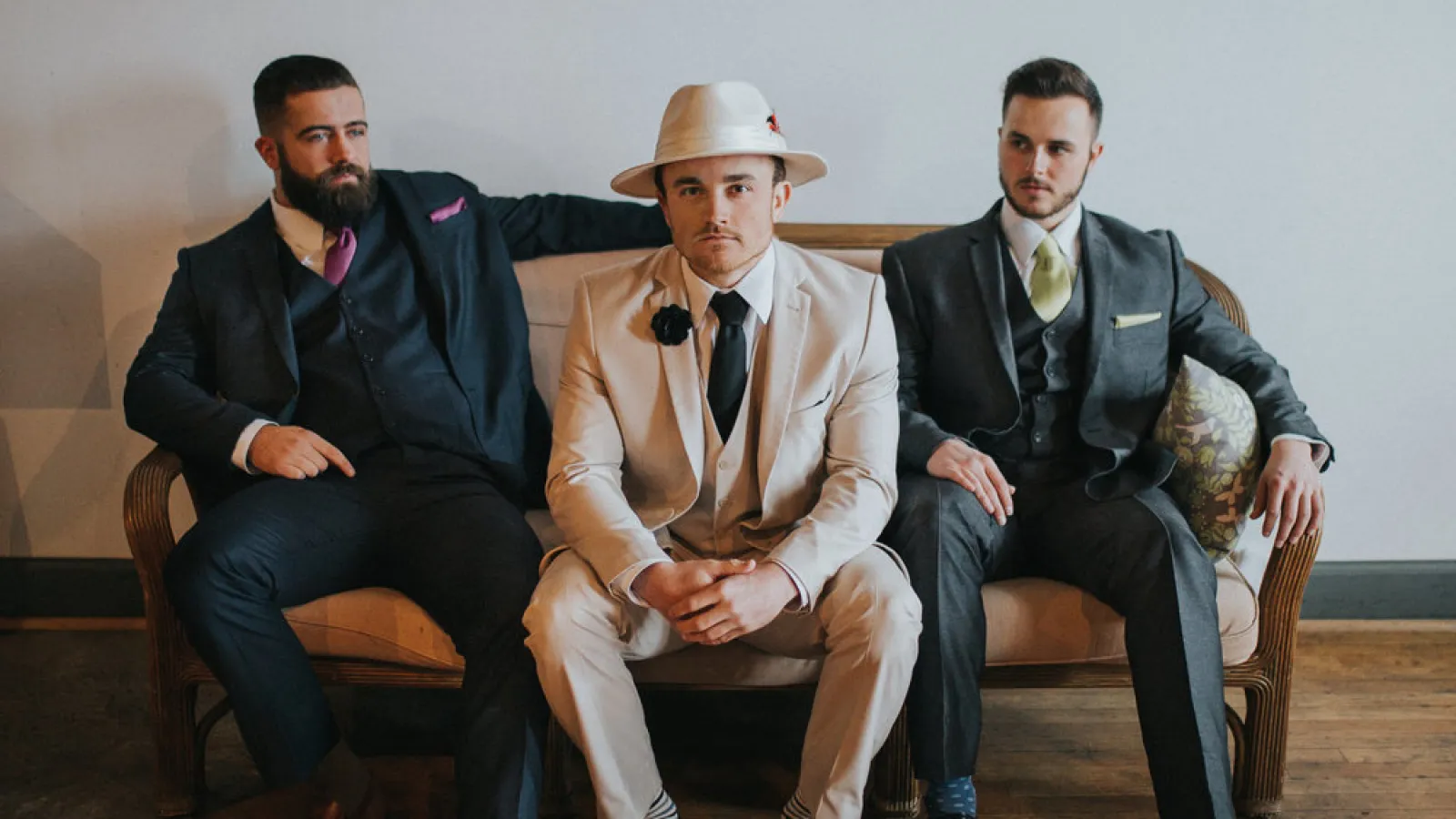 a group of men sitting on chairs