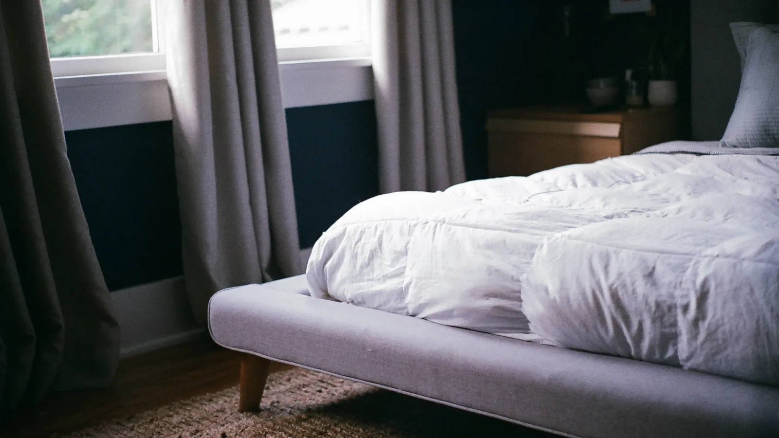 a bed with white sheets