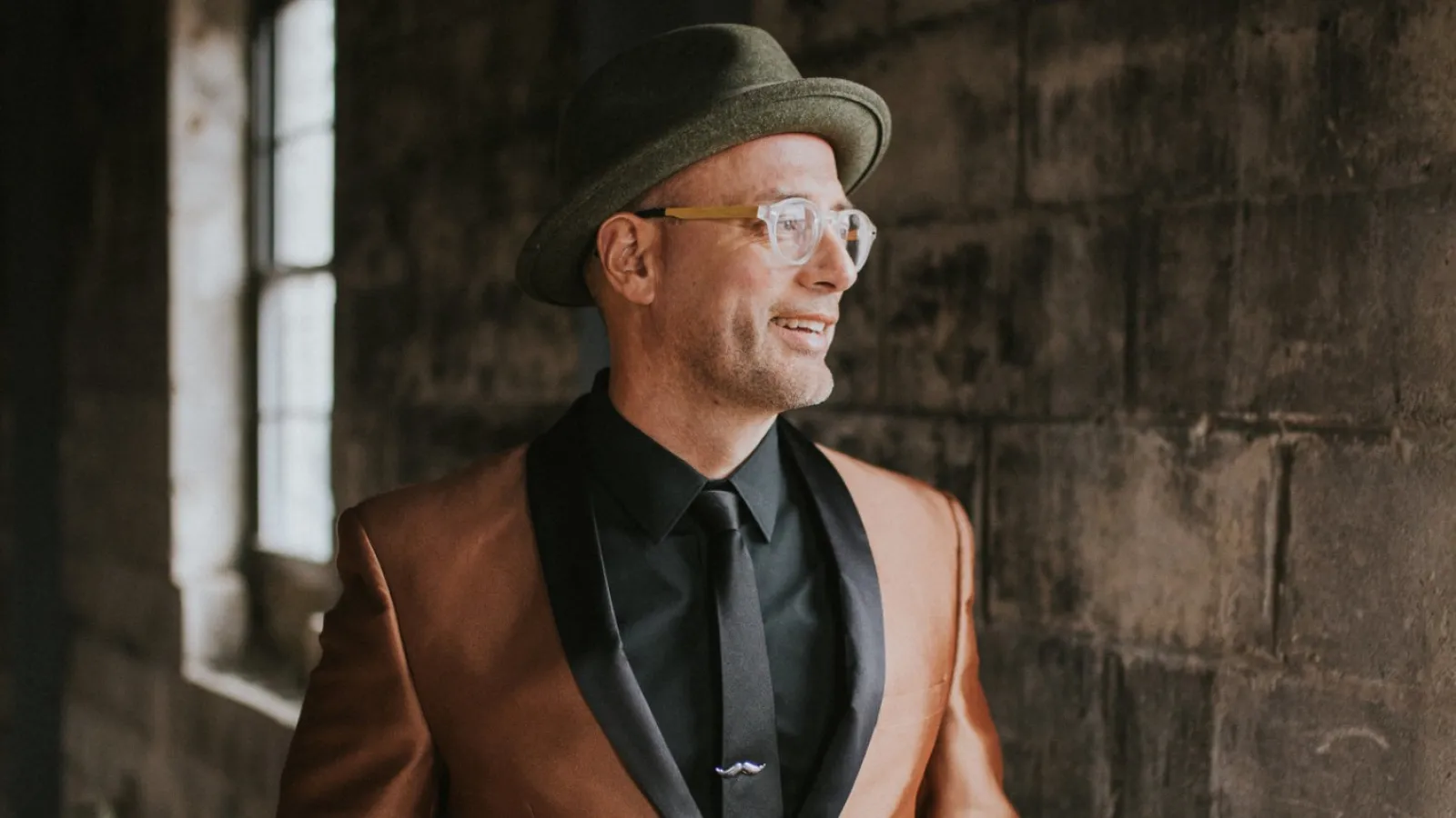 a man wearing a hat and glasses