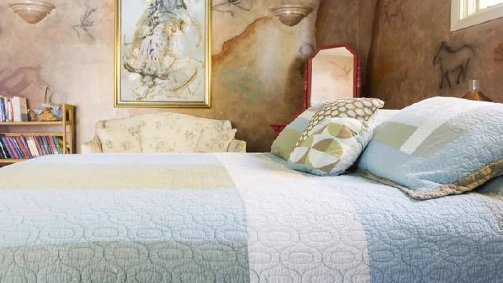 a couple of beds with pillows