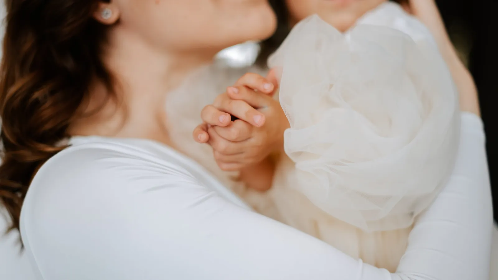 a woman holding a baby