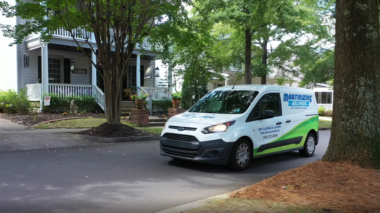 a white van parked on the side of a street