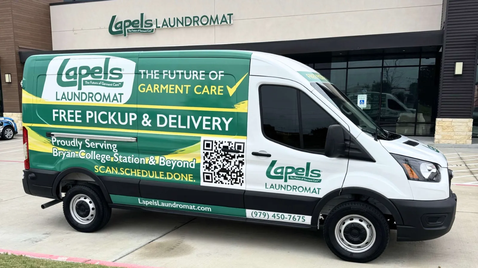 Lapels Laundromat delivery van parked outside the store offering free pickup and delivery garment care services.
