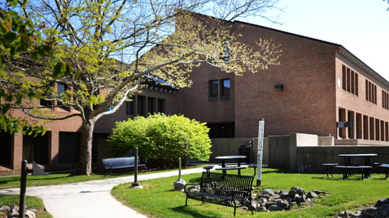 a building with a park in front