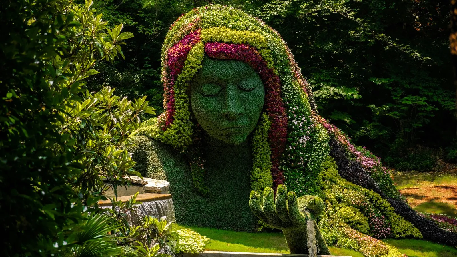 a statue of a person with a green headdress