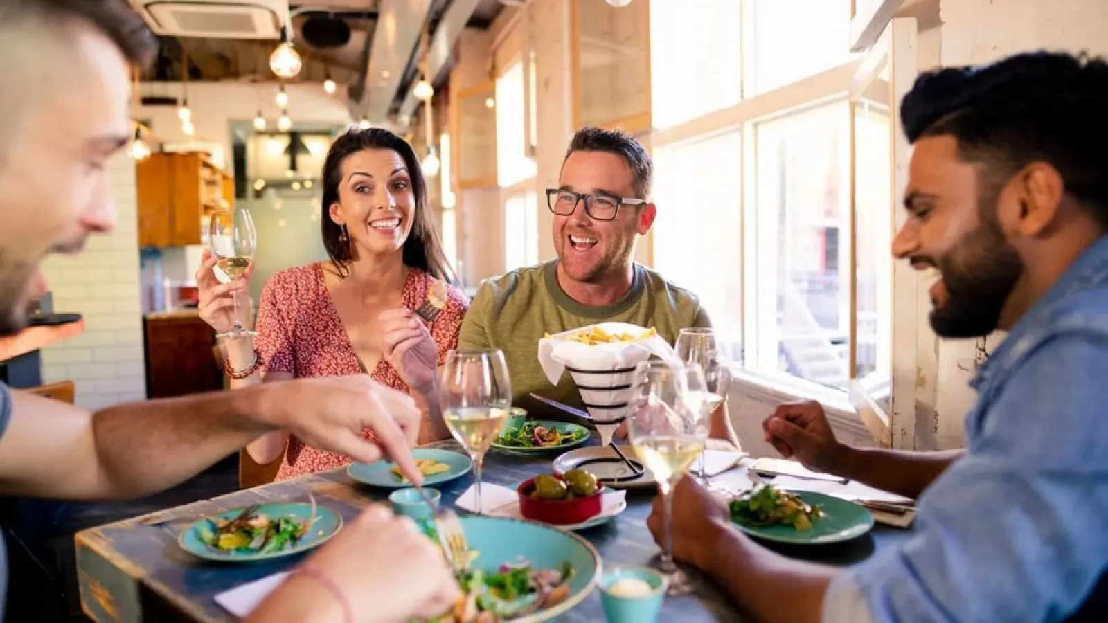 a group of people eating at a table