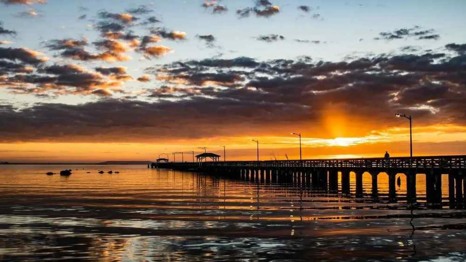 a sunset over a pier