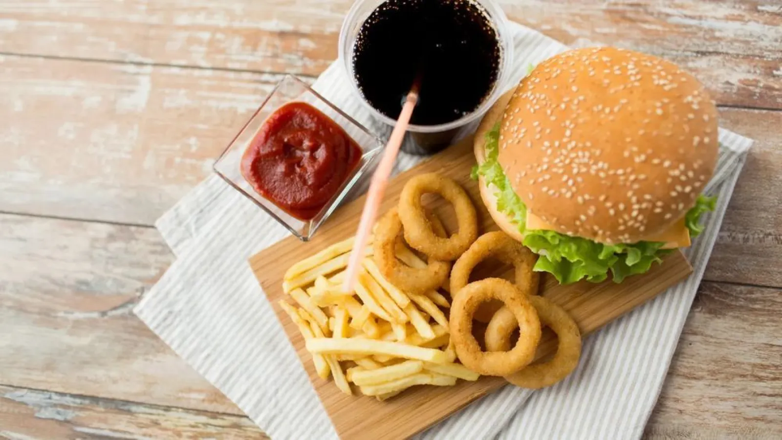 a burger and fries on a tray