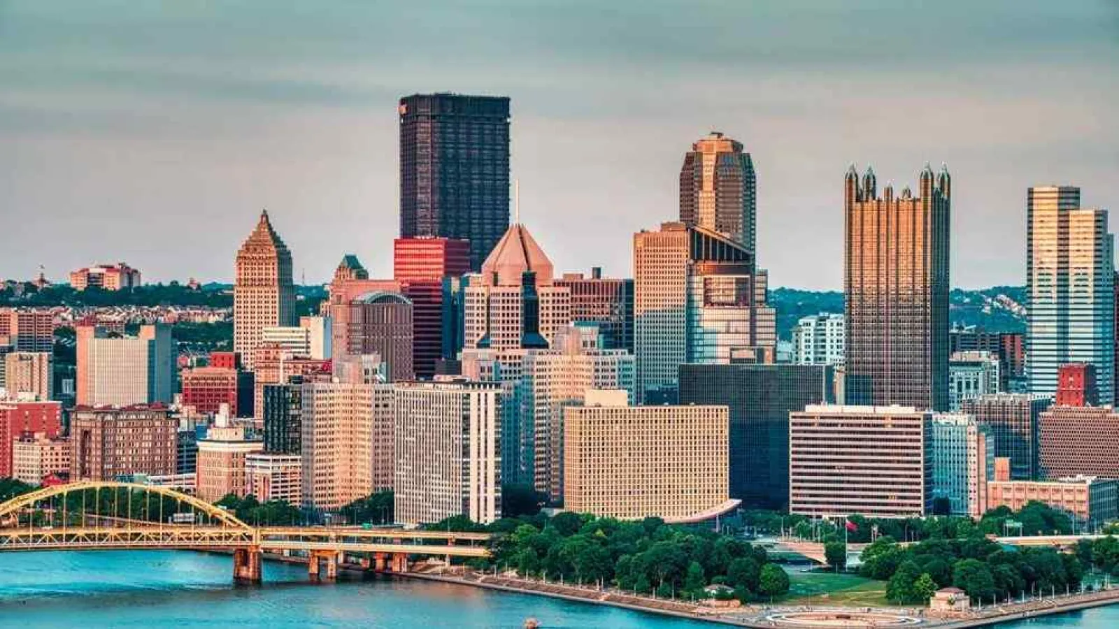 a city skyline with a river