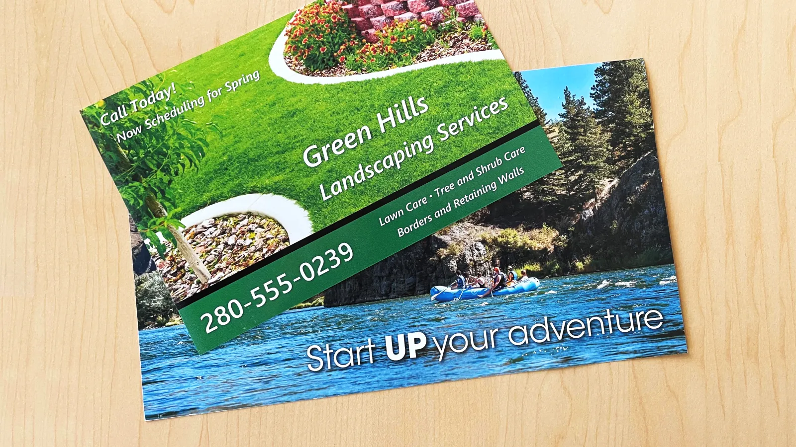 Two Promotional Postcards lying on a table