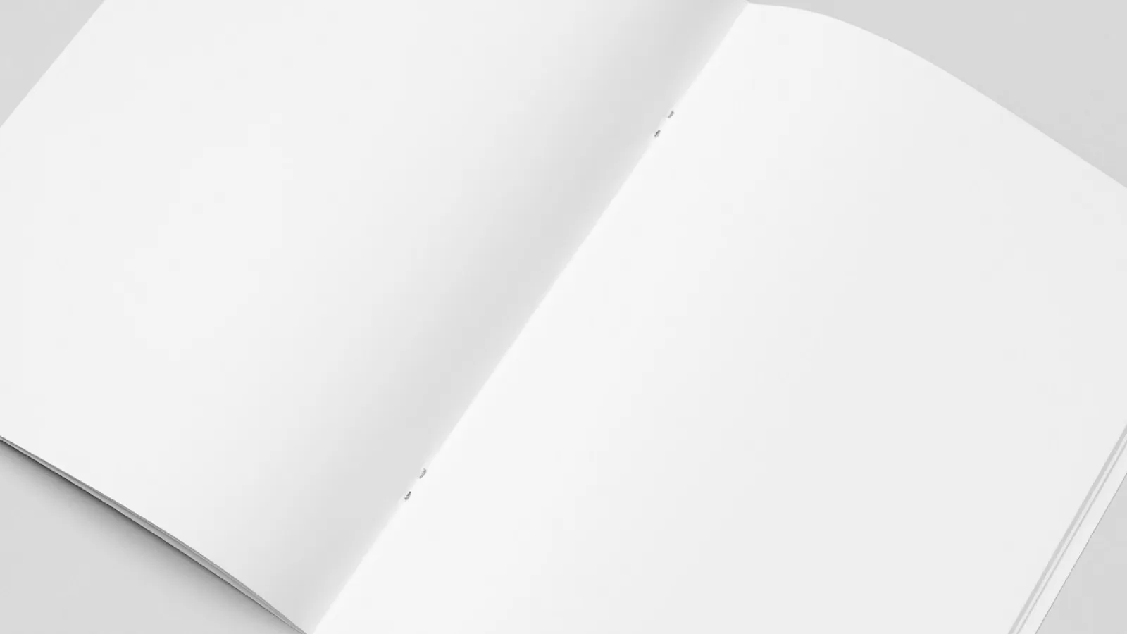 An open Saddle-Stitched Book lying on a counter