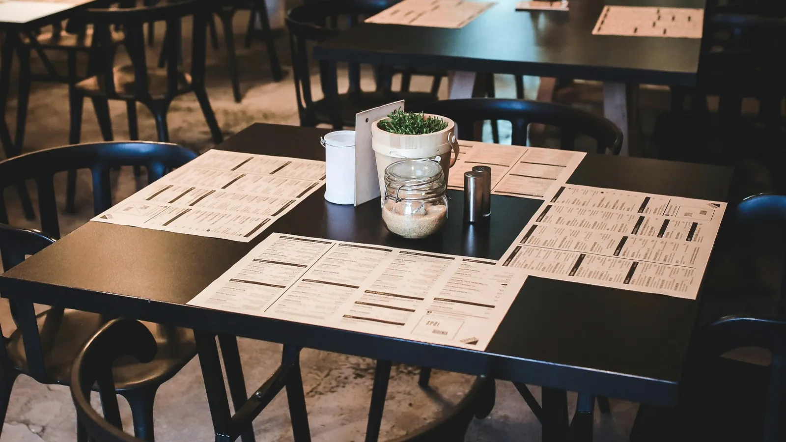 Restaurant tables with custom printed Placemats on them