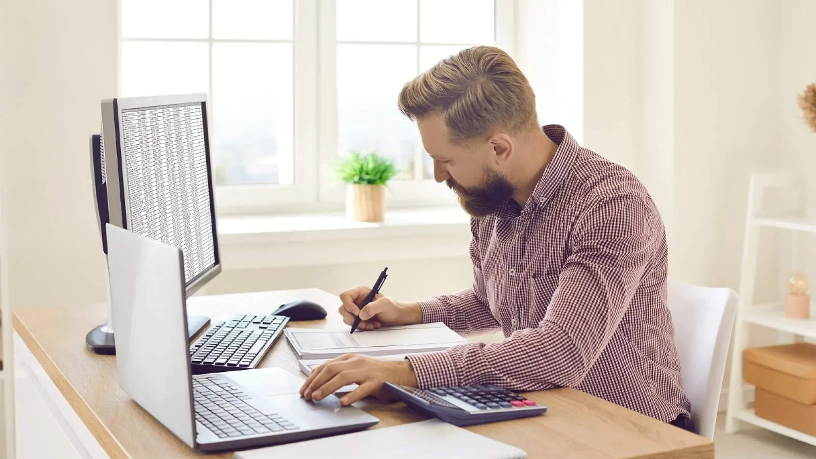 A man calculating a Quote for a Printing Project