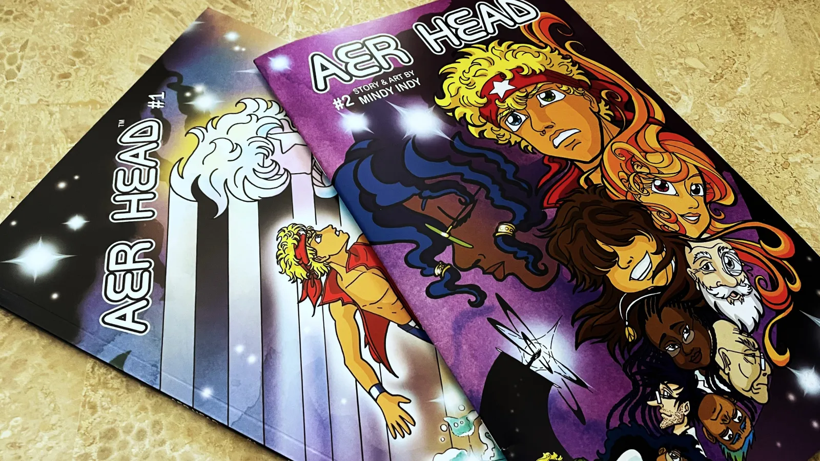 Two Comic Books lying on a table