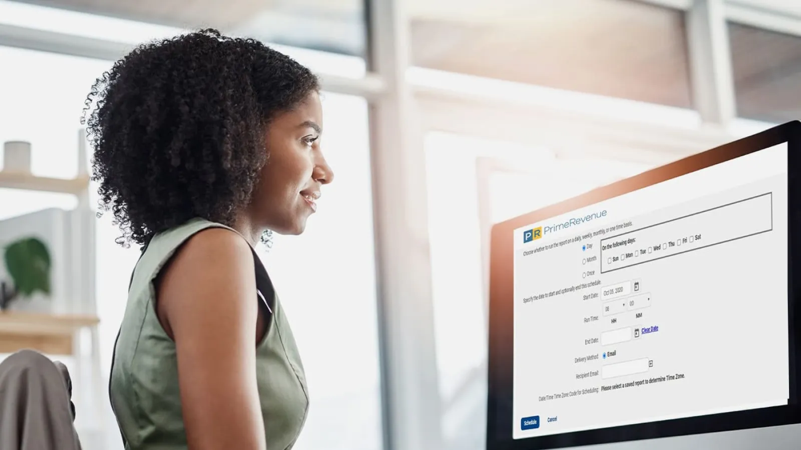 a woman looking at a computer screen