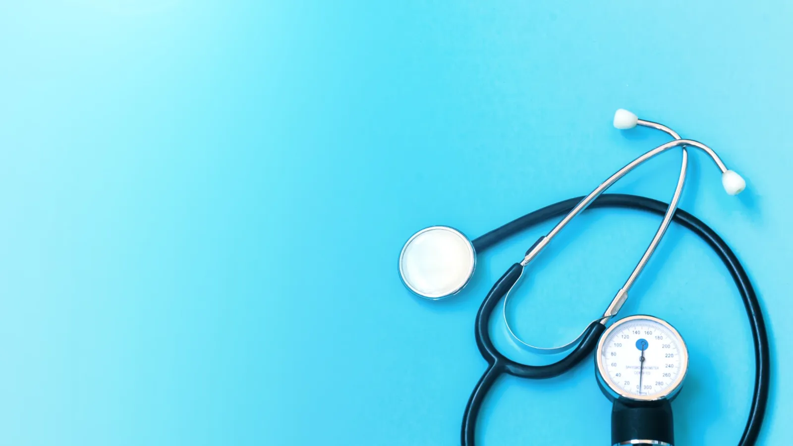 a stethoscope with a clock and a round white ball