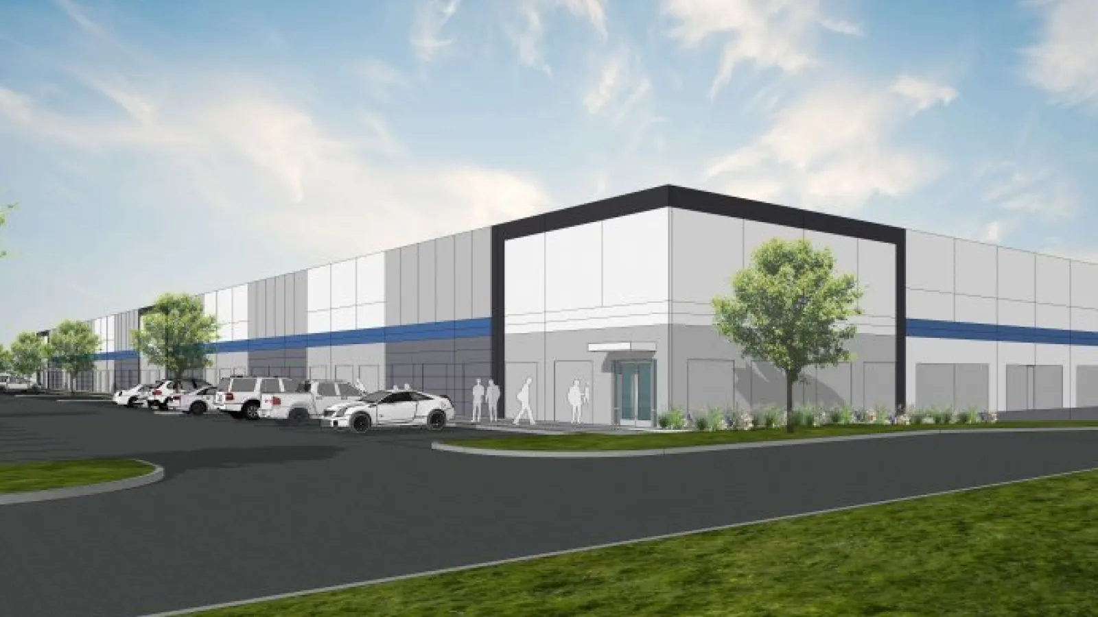 Modern industrial warehouse building with parking lot, cars, trees, and clear blue sky in daytime.