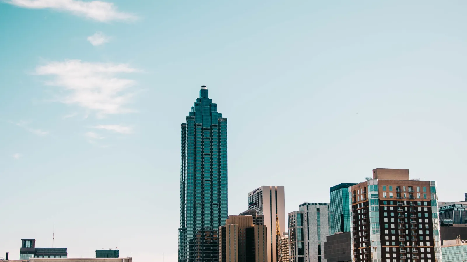 a city skyline with tall buildings