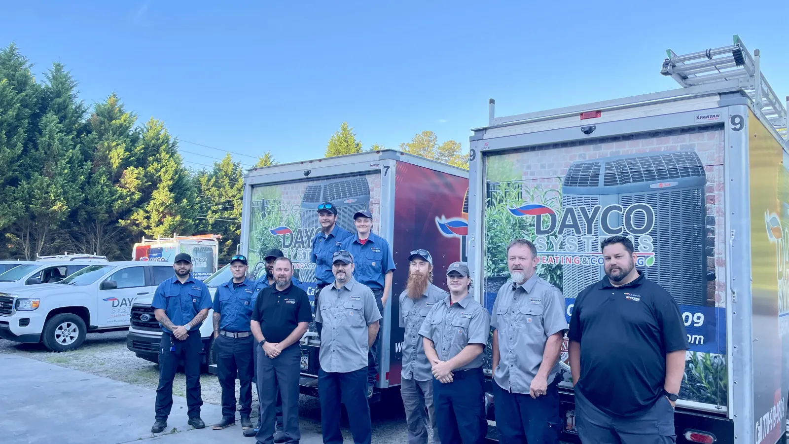 a group of people standing in front of a food truck