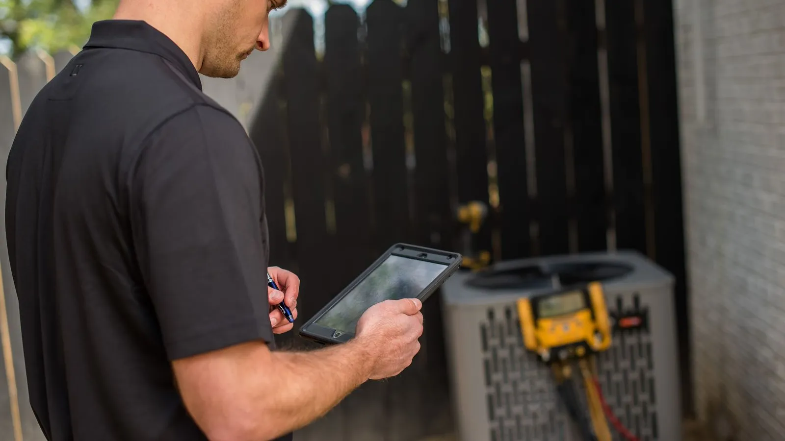 a man holding a tablet