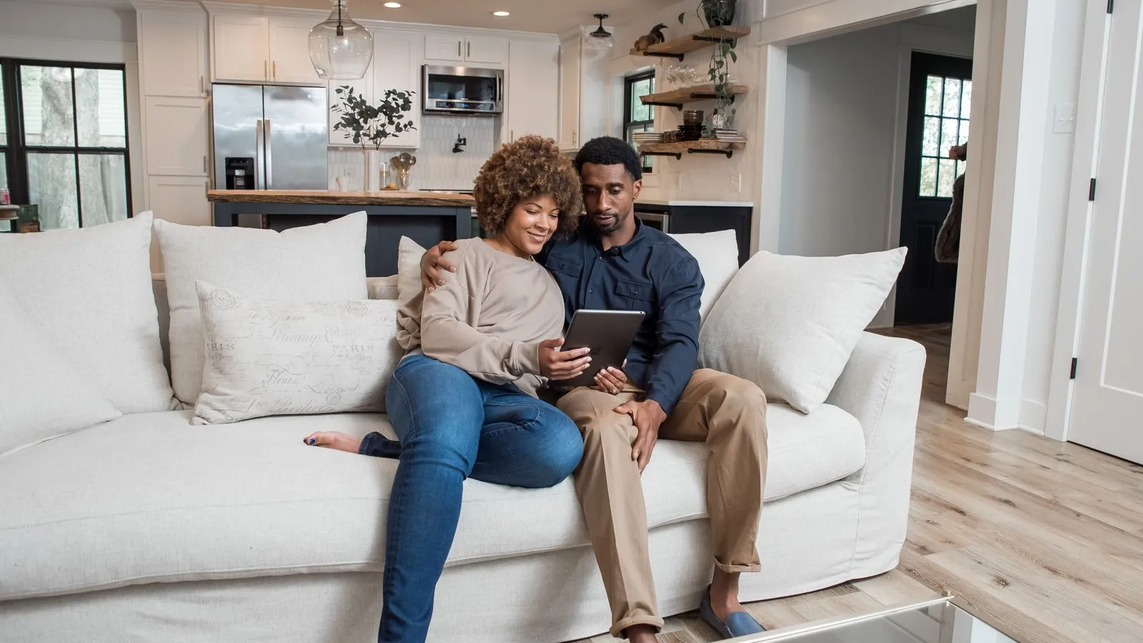 a man and woman sitting on a couch