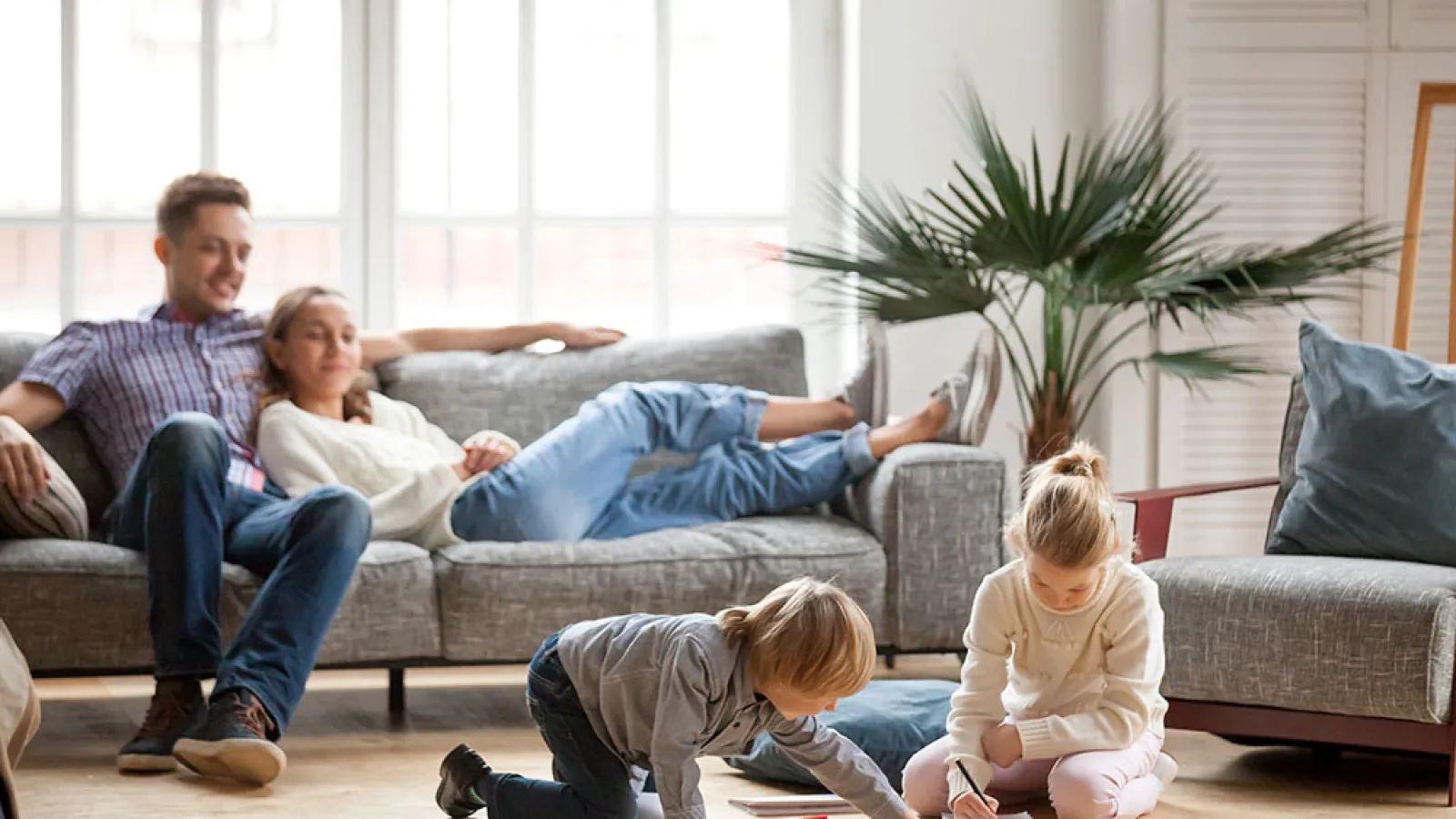 a family sitting on the floor