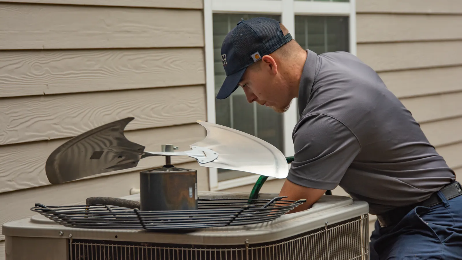 a man cooking food on a grill