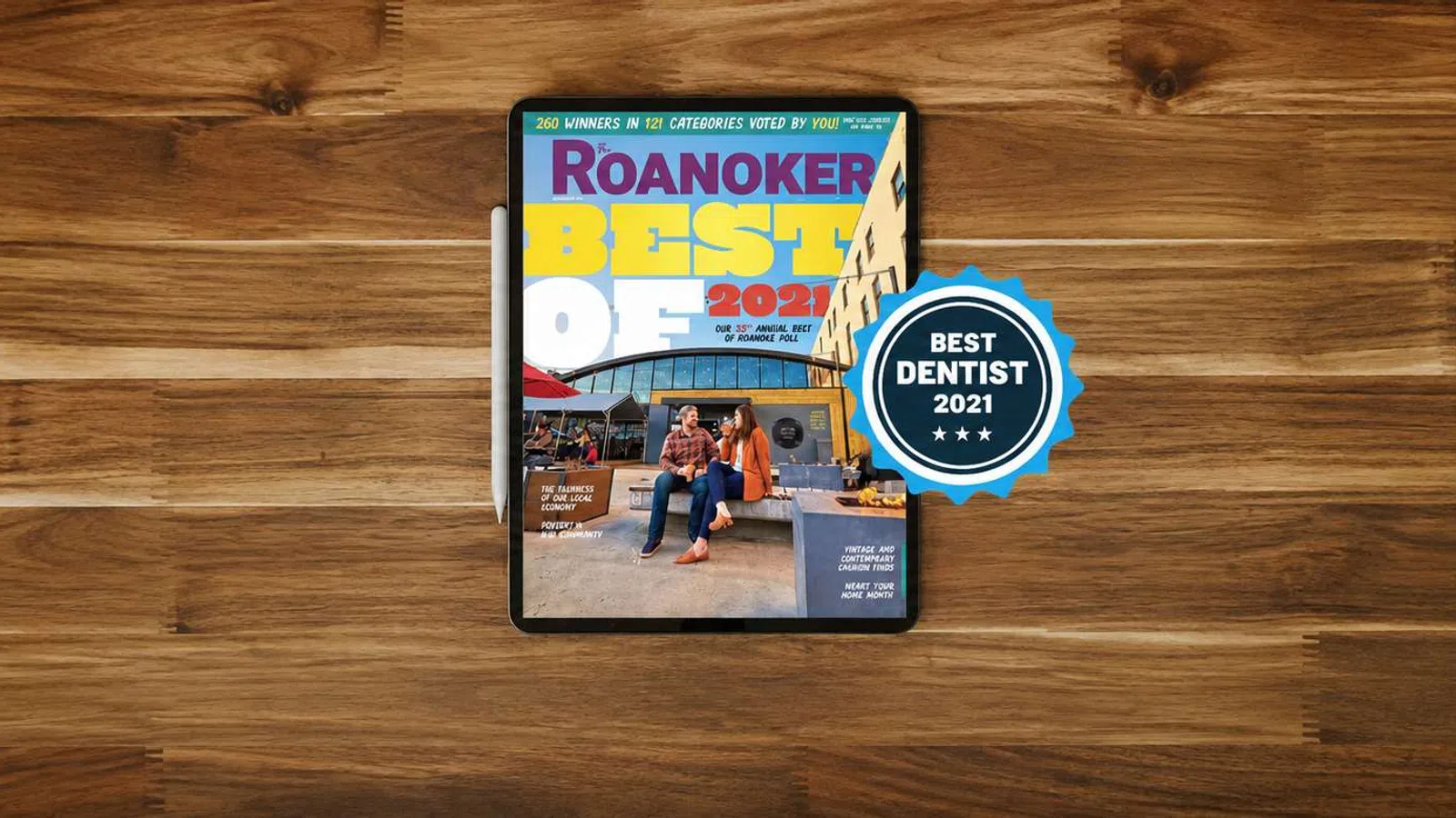 Tablet displaying Roanoker's Best of 2021 with blue badge for best dentist on wooden surface