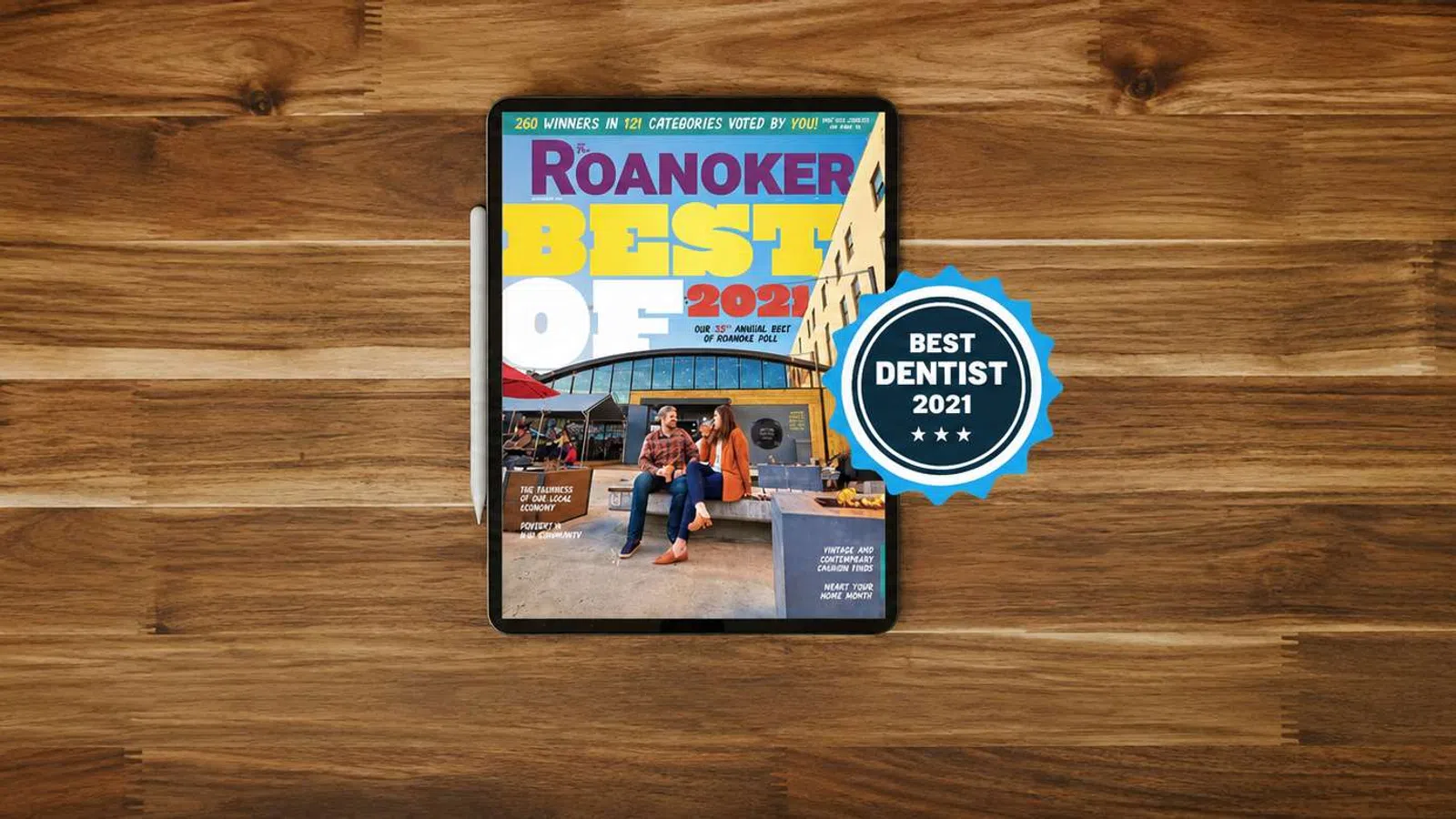 Tablet displaying Roanoker's Best of 2021 with blue badge for best dentist on wooden surface