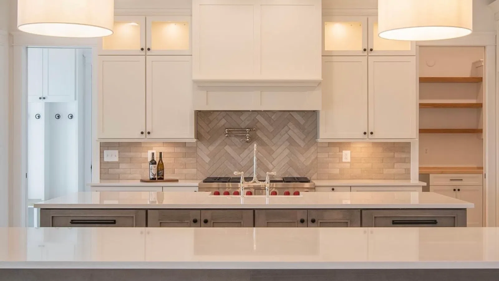 a kitchen with white cabinets