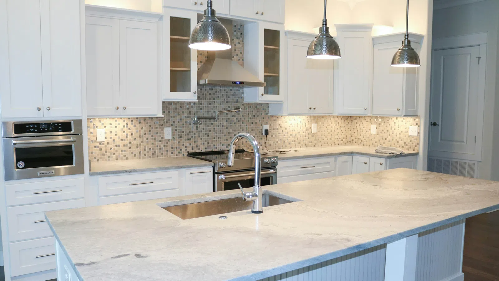 a kitchen with white cabinets