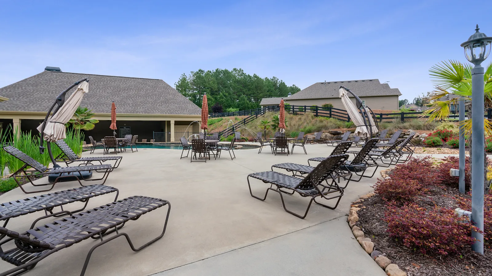 a patio with chairs and tables