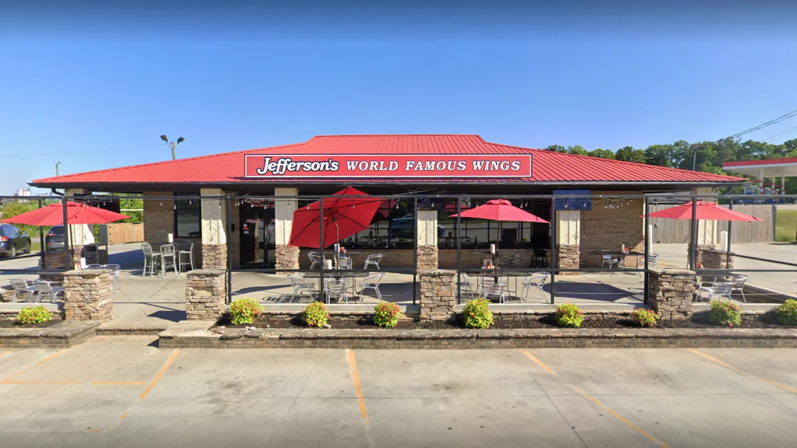 a building with red umbrellas