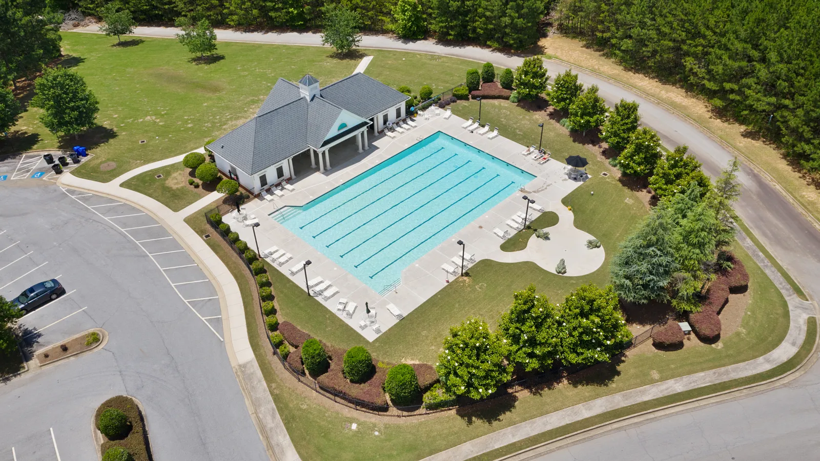 a swimming pool surrounded by trees