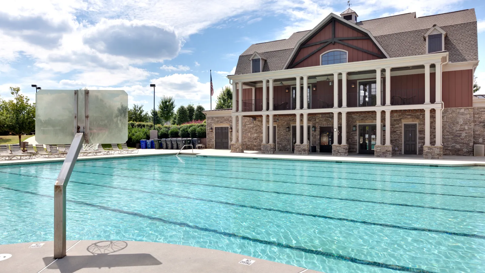 a swimming pool in front of a building